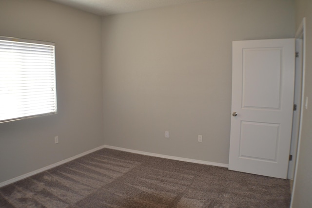 6016 N Sandia Ct, Rio Rancho, NM 87144 - unfurnished room with dark colored carpet and baseboards