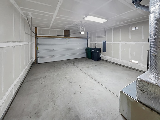 7110 Wasilla Dr NE, Rio Rancho, NM 87144 - garage featuring a garage door opener and electric panel