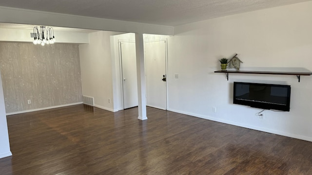 3839 Montgomery Blvd NE Unit 724, Albuquerque, NM 87109 - unfurnished living room with visible vents, baseboards, and wood finished floors