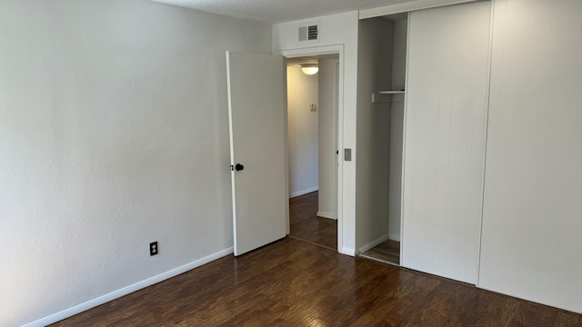 3839 Montgomery Blvd NE Unit 724, Albuquerque, NM 87109 - unfurnished bedroom featuring wood finished floors, baseboards, a closet, and visible vents