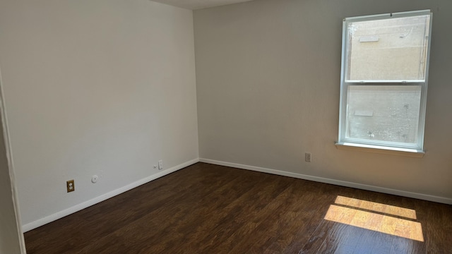 3839 Montgomery Blvd NE Unit 724, Albuquerque, NM 87109 - unfurnished room with dark wood-style floors and baseboards