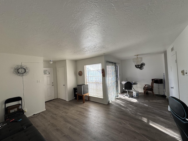 4601 Carlisle Blvd NE Unit E1, Albuquerque, NM 87109 - interior space with visible vents, a textured ceiling, and wood finished floors