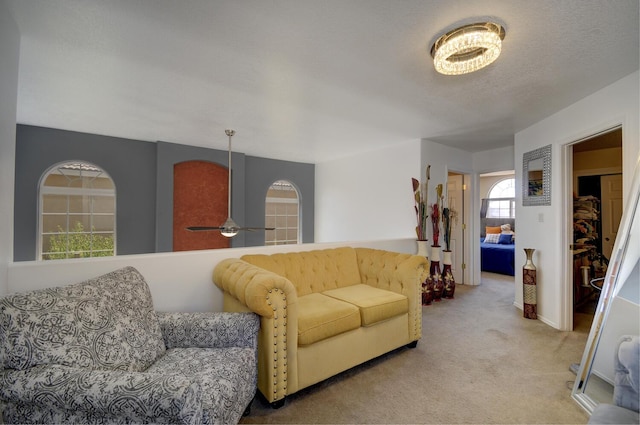 4844 Stafford Pl NW, Albuquerque, NM 87120 - living room featuring carpet flooring, a textured ceiling, and a ceiling fan