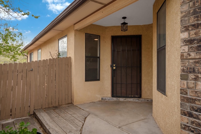 6624 Conrad Ave NW, Albuquerque, NM 87120 - entrance to property featuring stucco siding and fence
