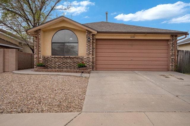 6624 Conrad Ave NW, Albuquerque, NM 87120 - single story home with an attached garage, fence, brick siding, and concrete driveway