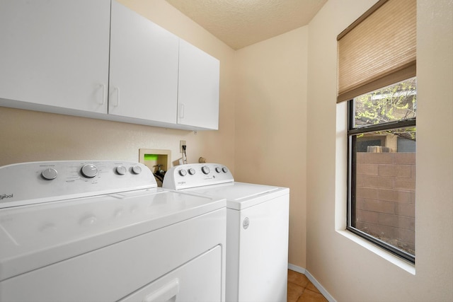6624 Conrad Ave NW, Albuquerque, NM 87120 - laundry room with washer and dryer, baseboards, cabinet space, and light tile patterned floors