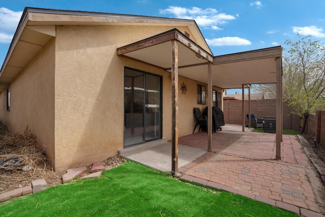 6624 Conrad Ave NW, Albuquerque, NM 87120 - rear view of property with a patio area, stucco siding, and fence