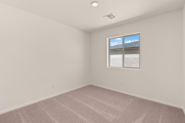 2518 Desi Loop, Belen, NM 87002 - carpeted spare room featuring visible vents and baseboards