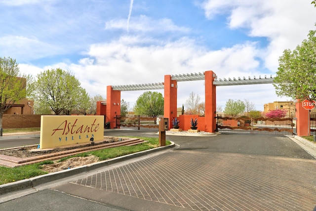 2467 Corvara Dr SE, Rio Rancho, NM 87124 - community sign with a gate and fence