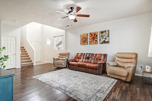 2467 Corvara Dr SE, Rio Rancho, NM 87124 - living area featuring a ceiling fan, dark wood-style floors, and baseboards