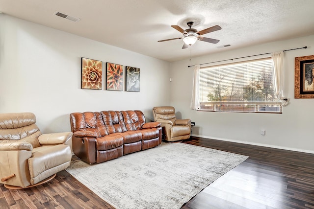 2467 Corvara Dr SE, Rio Rancho, NM 87124 - living room featuring wood finished floors, a ceiling fan, and baseboards