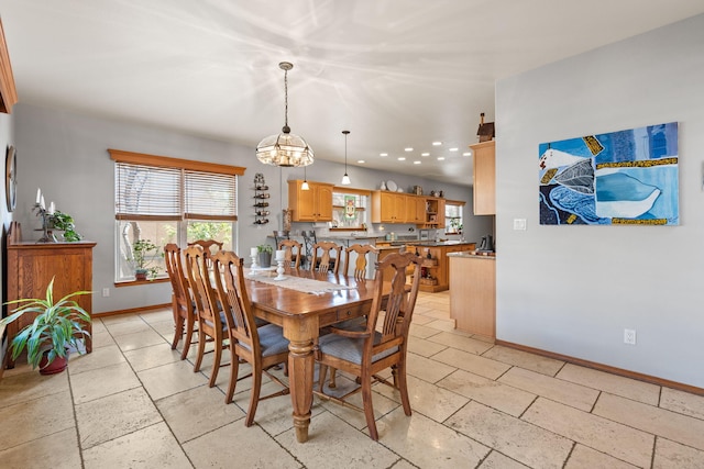 dining room featuring an inviting chandelier, baseboards, and recessed lighting
