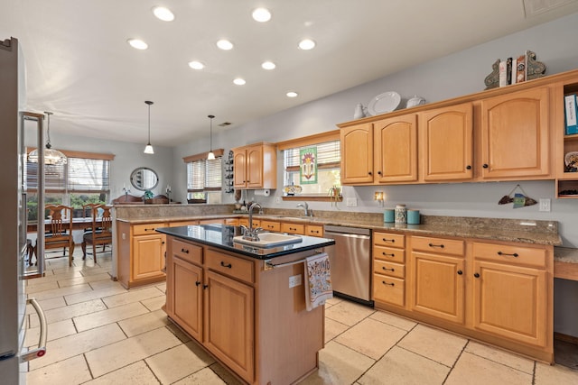 kitchen with recessed lighting, an island with sink, dishwasher, and a sink