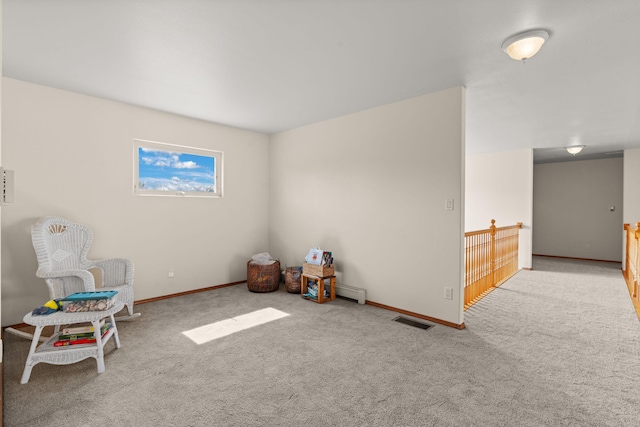 interior space with baseboards, visible vents, and carpet floors