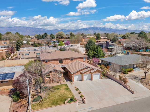 bird's eye view featuring a mountain view and a residential view
