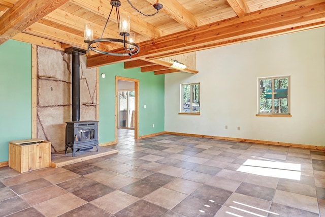 interior space featuring a wealth of natural light, a notable chandelier, wood ceiling, and beamed ceiling