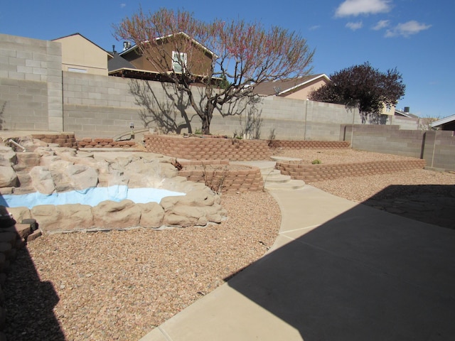 view of yard featuring a fenced backyard