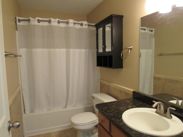 full bath featuring shower / bath combo, toilet, and vanity