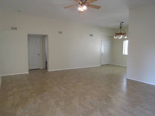 spare room with visible vents, baseboards, and ceiling fan with notable chandelier