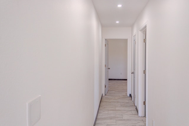 hallway with recessed lighting