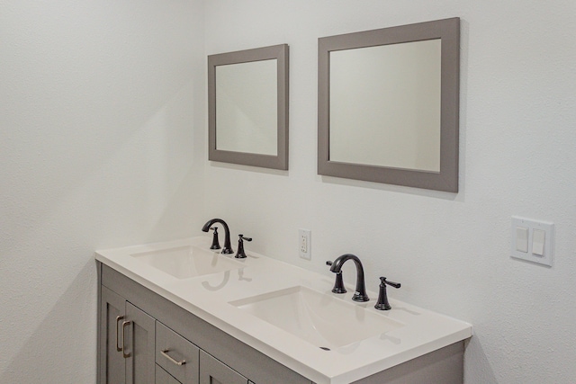 bathroom featuring double vanity and a sink