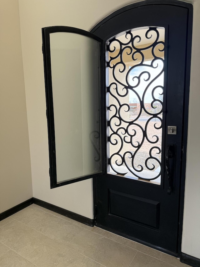 details featuring baseboards and a gate