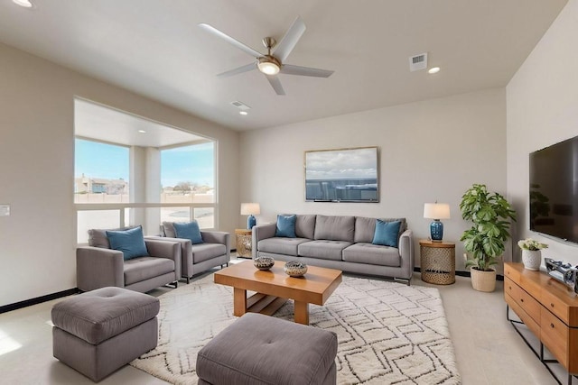 living room featuring light wood-type flooring, visible vents, a ceiling fan, and recessed lighting