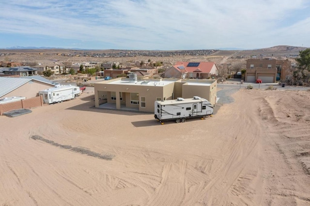 drone / aerial view featuring a mountain view and a residential view