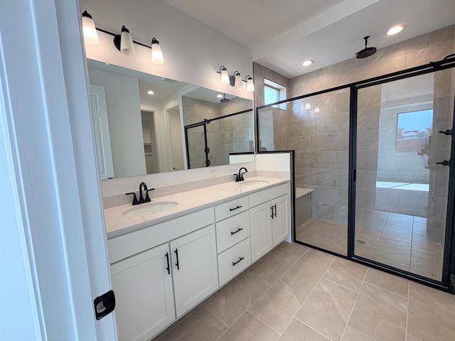 3225 Matador St SE, Rio Rancho, NM 87144 - bathroom with a shower stall, double vanity, and recessed lighting