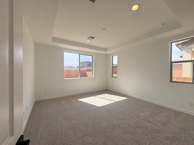 3225 Matador St SE, Rio Rancho, NM 87144 - carpeted empty room with a raised ceiling, plenty of natural light, recessed lighting, and a smoke detector