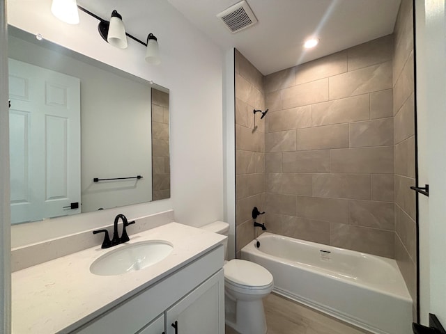 3225 Matador St SE, Rio Rancho, NM 87144 - full bath with vanity, shower / bathtub combination, wood finished floors, and recessed lighting