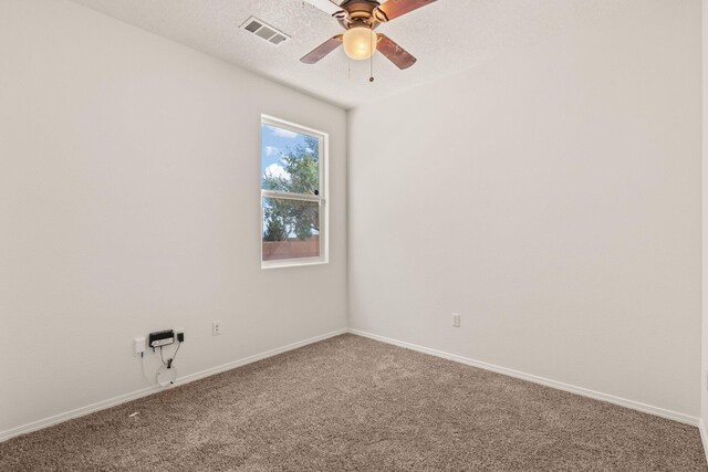 1941 Platina Rd SE, Rio Rancho, NM 87124 - carpeted spare room with baseboards, a ceiling fan, and visible vents