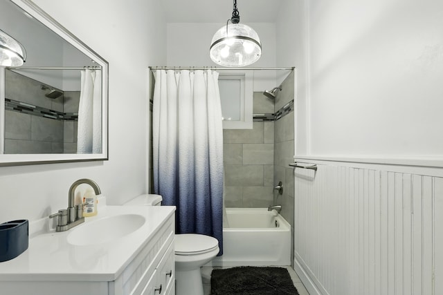 223 Edith Blvd SE, Albuquerque, NM 87102 - bathroom with toilet, vanity, shower / tub combo, and wainscoting