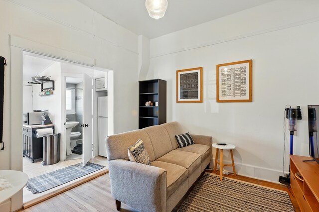 223 Edith Blvd SE, Albuquerque, NM 87102 - living area with baseboards and wood finished floors