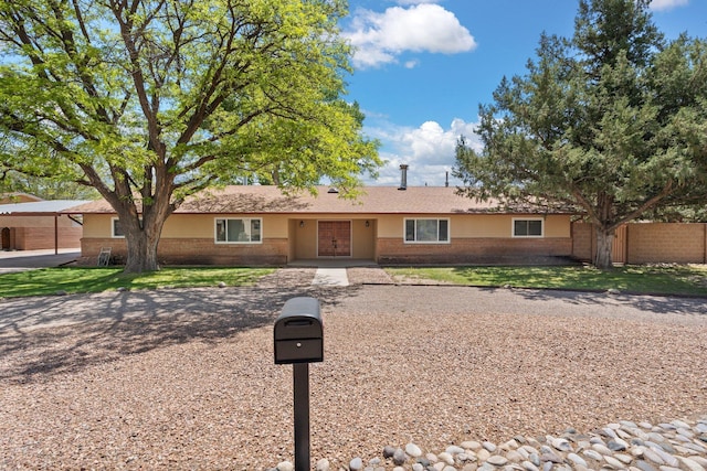 single story home with brick siding