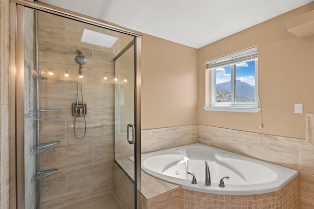 bathroom featuring a bath and a stall shower
