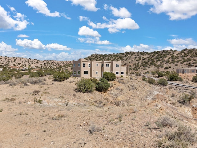mountain view featuring a desert landscape and rural landscape