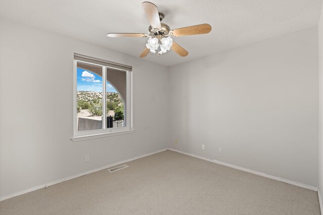 115 Camino De Las Huertas, Placitas, NM 87043 - kitchen with dark countertops, finished concrete flooring, ceiling fan, recessed lighting, and white cabinetry
