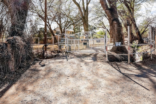view of gate with fence