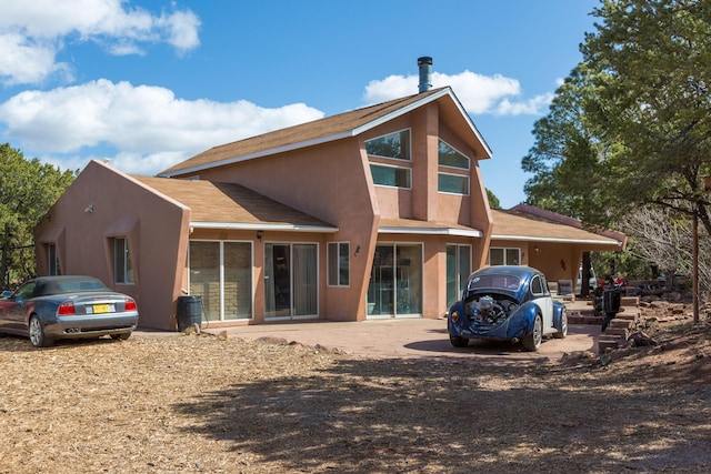 32 Puntilla Dr Unit B, Tijeras, NM 87059 - rear view of house with stucco siding