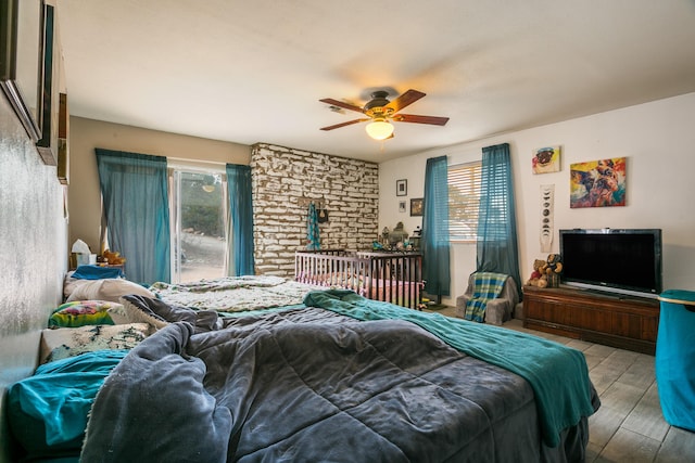 32 Puntilla Dr Unit B, Tijeras, NM 87059 - bedroom featuring wood finished floors, a ceiling fan, and multiple windows