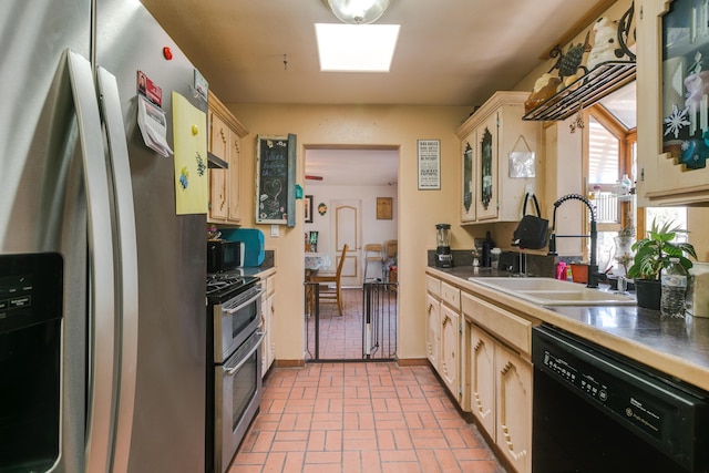32 Puntilla Dr Unit B, Tijeras, NM 87059 - kitchen with brick floor, glass insert cabinets, appliances with stainless steel finishes, and a sink