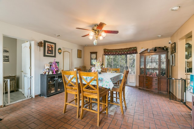 32 Puntilla Dr Unit B, Tijeras, NM 87059 - dining area with ceiling fan and brick floor