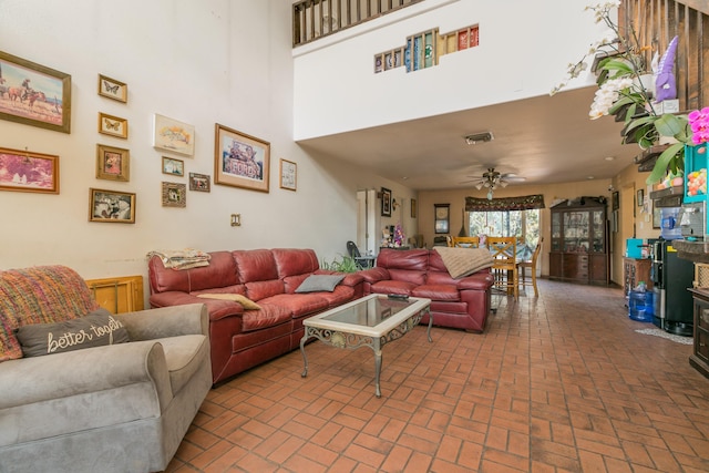 32 Puntilla Dr Unit B, Tijeras, NM 87059 - living room with ceiling fan and brick floor