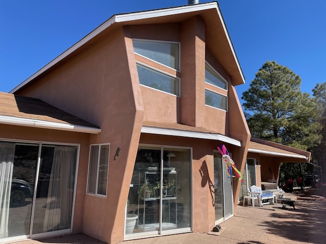 32 Puntilla Dr Unit B, Tijeras, NM 87059 - rear view of property featuring a patio area and stucco siding