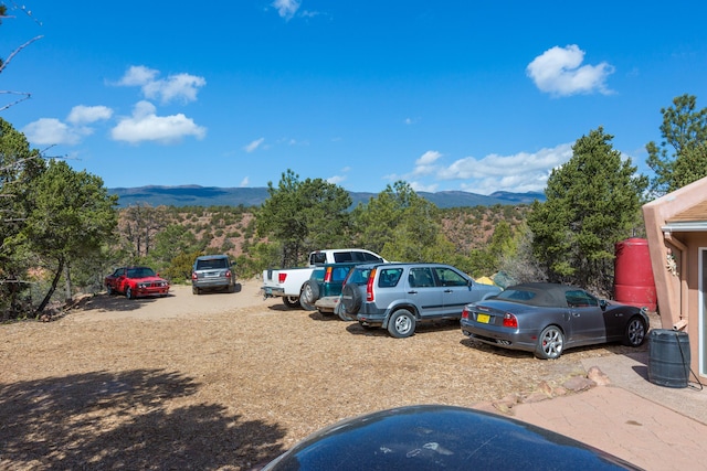 32 Puntilla Dr Unit B, Tijeras, NM 87059 - uncovered parking lot with a mountain view
