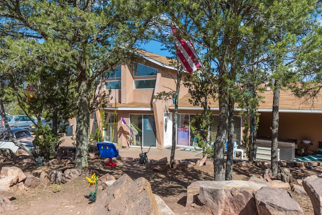 32 Puntilla Dr Unit B, Tijeras, NM 87059 - rear view of house featuring stucco siding