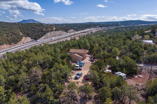 32 Puntilla Dr Unit B, Tijeras, NM 87059 - aerial view with a wooded view and a mountain view