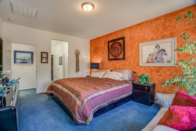 carpeted bedroom with visible vents, baseboards, wallpapered walls, and a textured ceiling