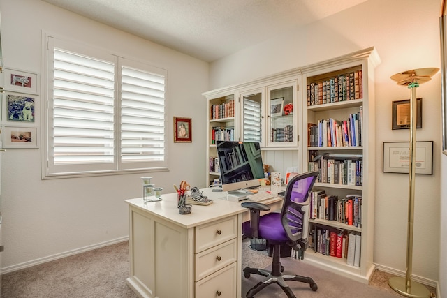 office space featuring light colored carpet and baseboards
